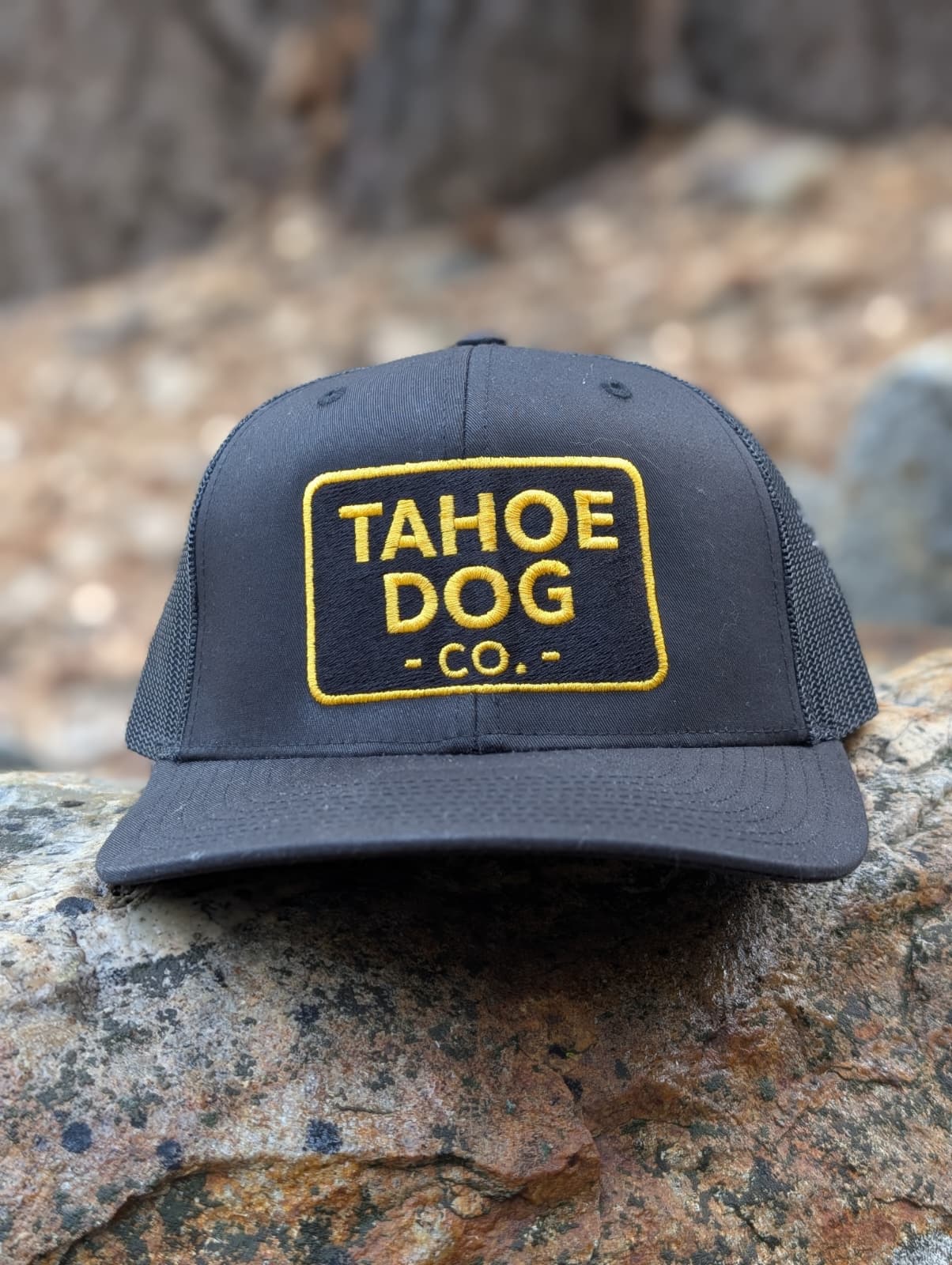 Black trucker hat featuring Tahoe Dog Co. logo (new as of 12/5/25!)